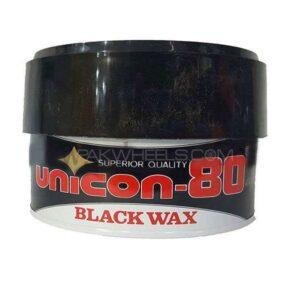 Unicon 80 Black Wax applied on a car’s surface for a deep, high-gloss black finish.
